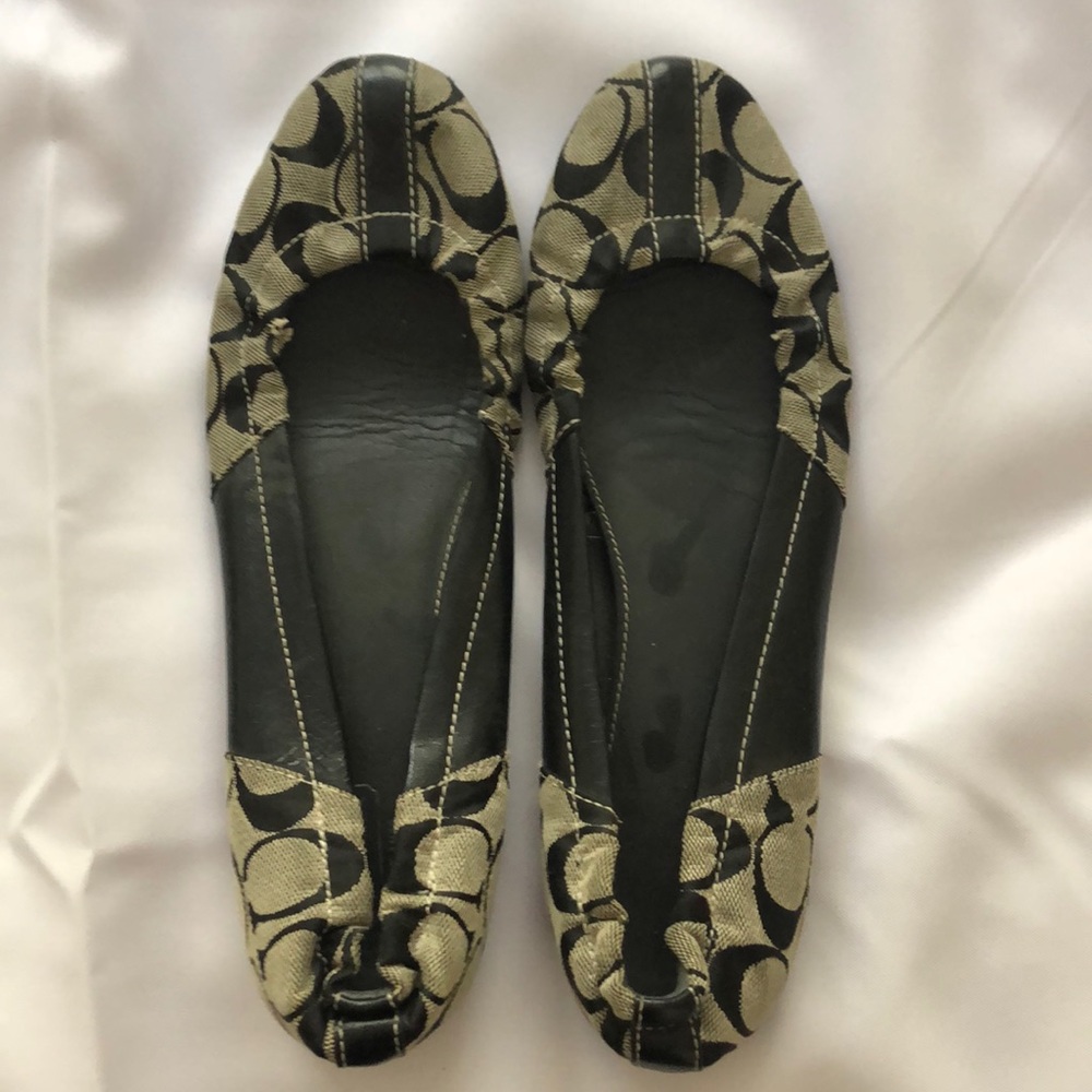 Black coach slip ons